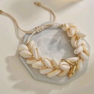 White and gold puka shell bracelet